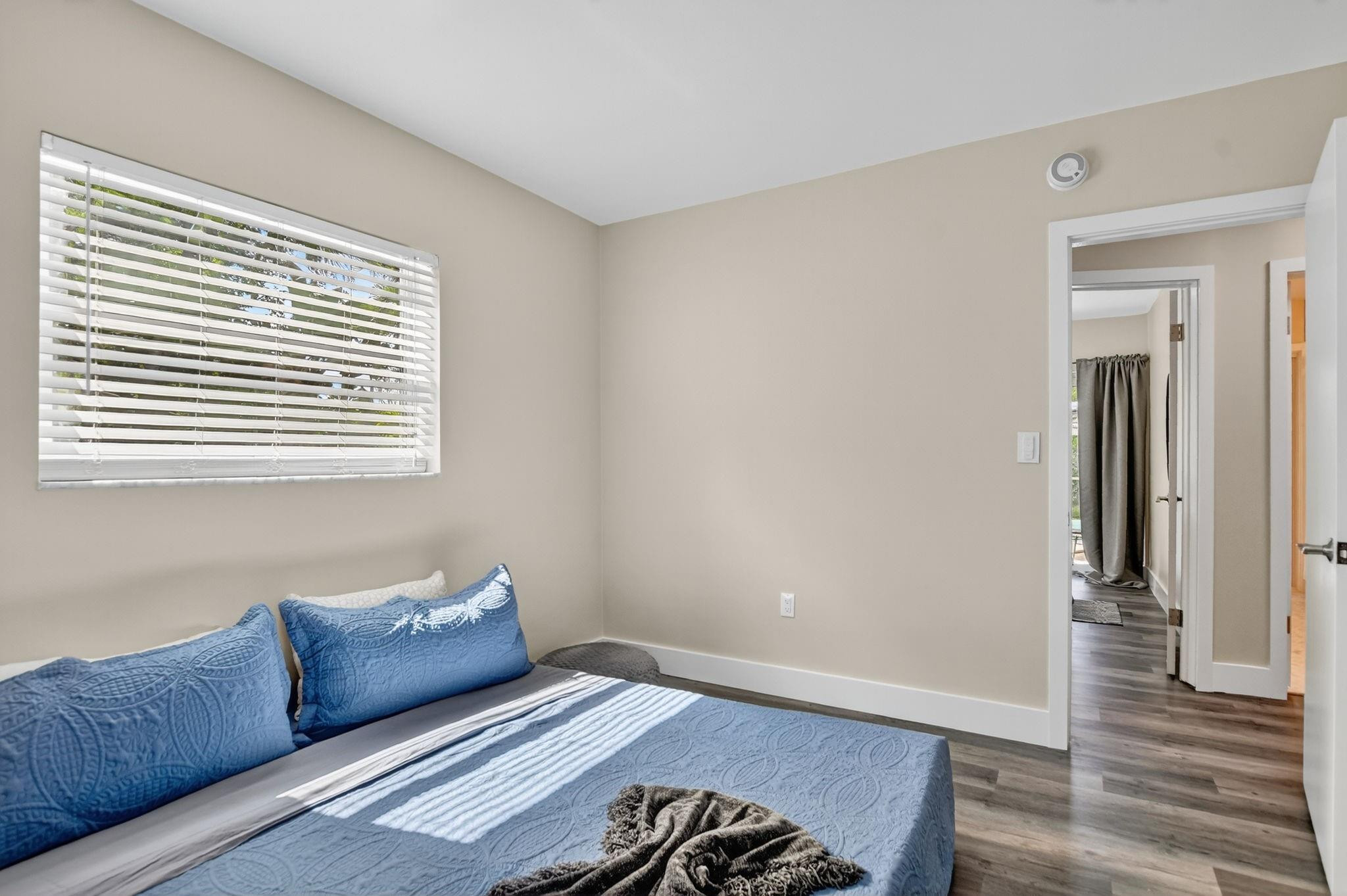 1650 Northwest 9th Street Boca Raton, FL 33486 - Photo 30 of 57 a living room with a couch and a window
