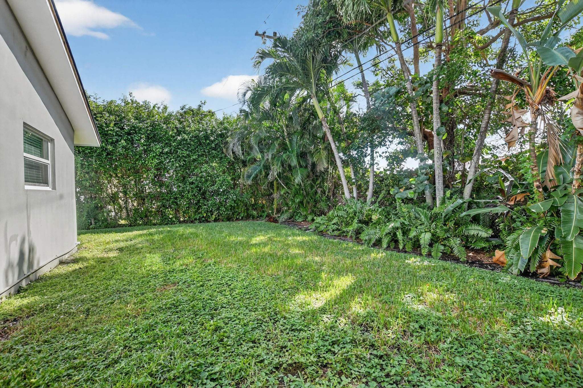 1650 Northwest 9th Street Boca Raton, FL 33486 - Photo 39 of 57 a view of a yard in front of a house