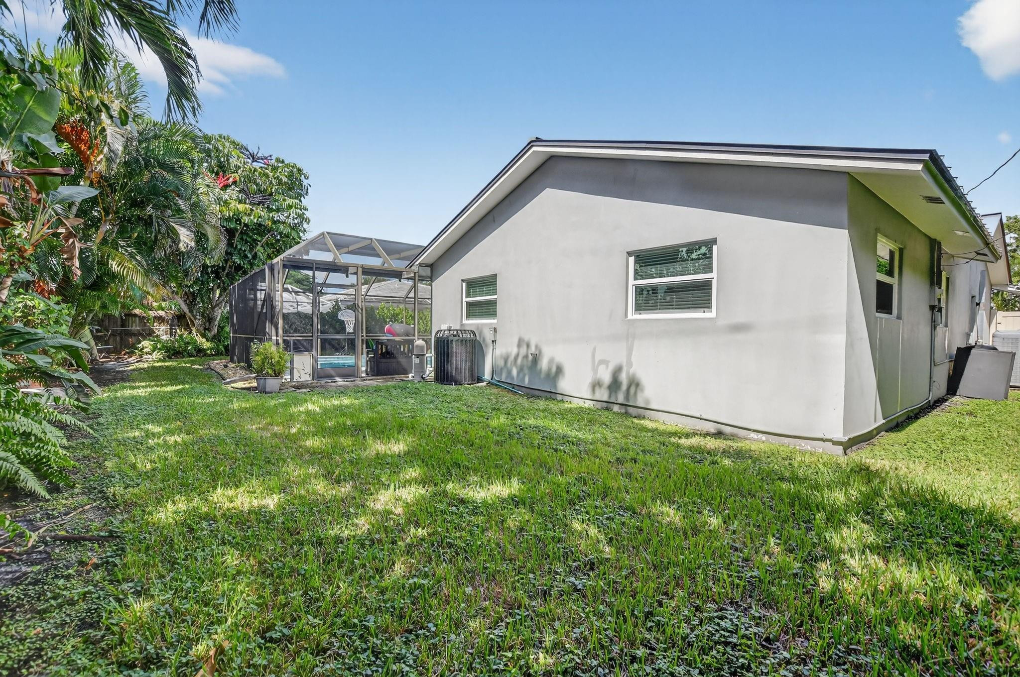 1650 Northwest 9th Street Boca Raton, FL 33486 - Photo 40 of 57 a view of backyard with a garden and plants