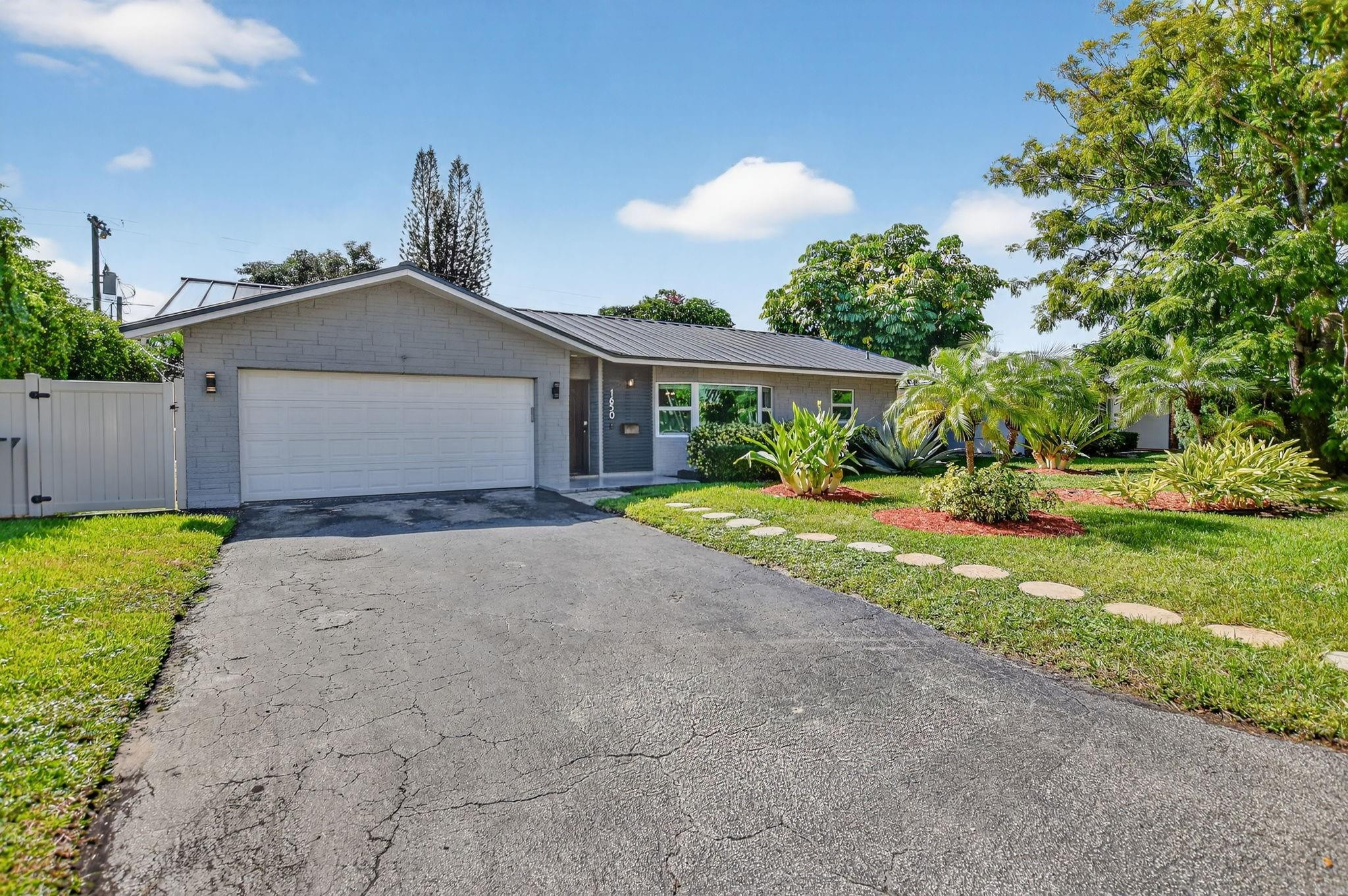 1650 Northwest 9th Street Boca Raton, FL 33486 - Photo 42 of 57 a view of a house with a yard