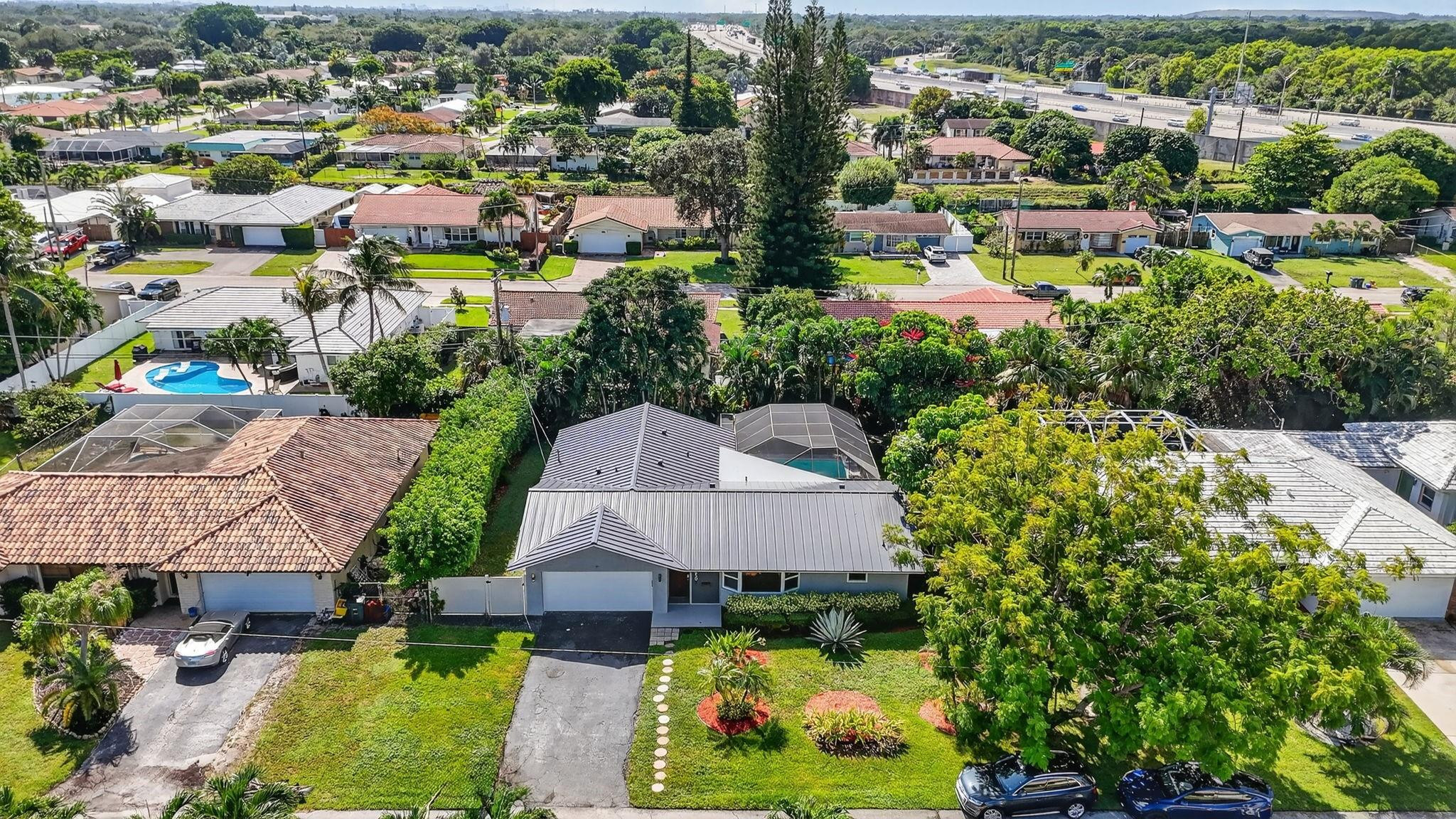 1650 Northwest 9th Street Boca Raton, FL 33486 - Photo 48 of 57 an aerial view of residential houses with outdoor space and street view
