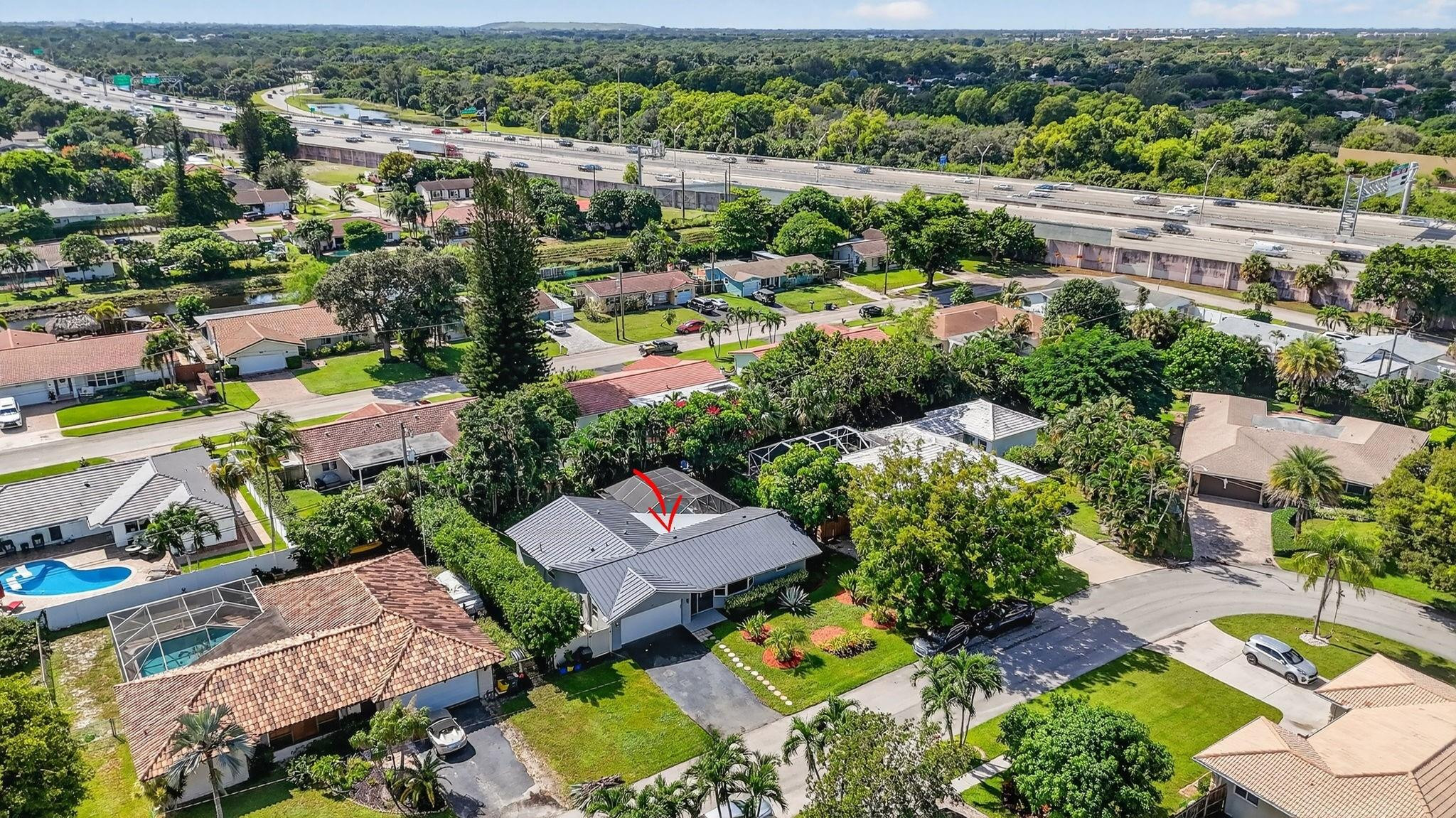 1650 Northwest 9th Street Boca Raton, FL 33486 - Photo 51 of 57 an aerial view of residential houses with outdoor space and parking