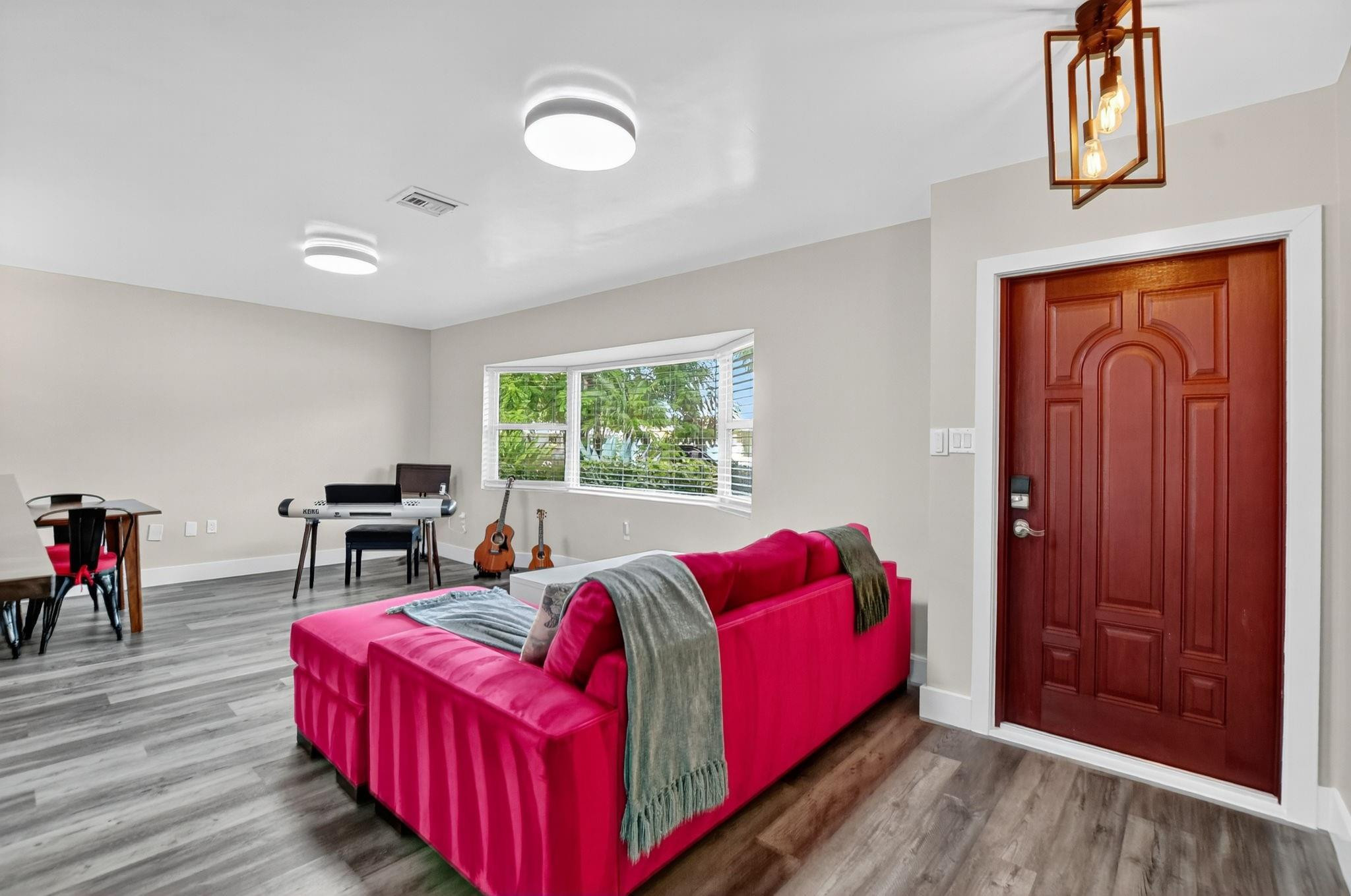 1650 Northwest 9th Street Boca Raton, FL 33486 - Photo 9 of 57 a living room with furniture and a window