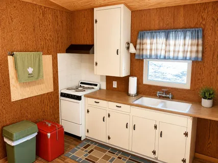 a kitchen with stainless steel appliances a stove a sink and a refrigerator