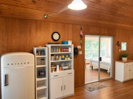a view of a storage and utility room with a window