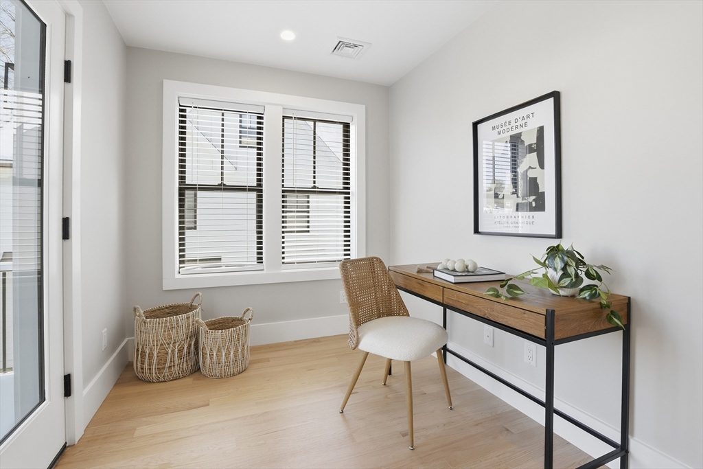 10 Webber Avenue, Unit 101 Bedford, MA 01730 - Photo 19 of 35 a living room with furniture and a window
