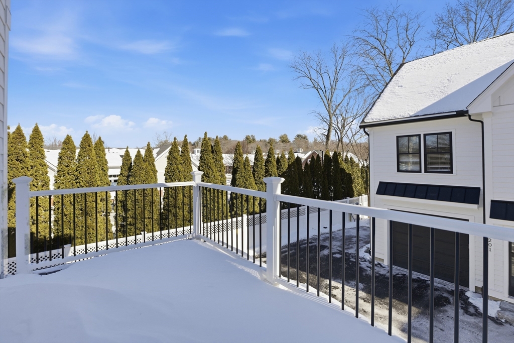 10 Webber Avenue, Unit 101 Bedford, MA 01730 - Photo 29 of 35 a view of a house with backyard and trees