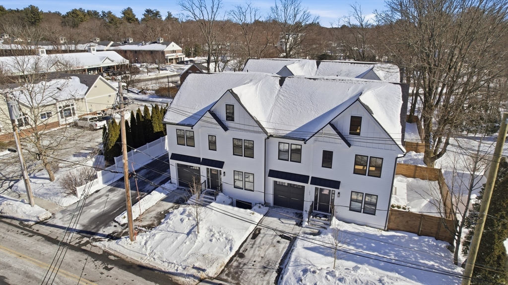 10 Webber Avenue, Unit 101 Bedford, MA 01730 - Photo 35 of 35 a view of a big house with pool and chairs