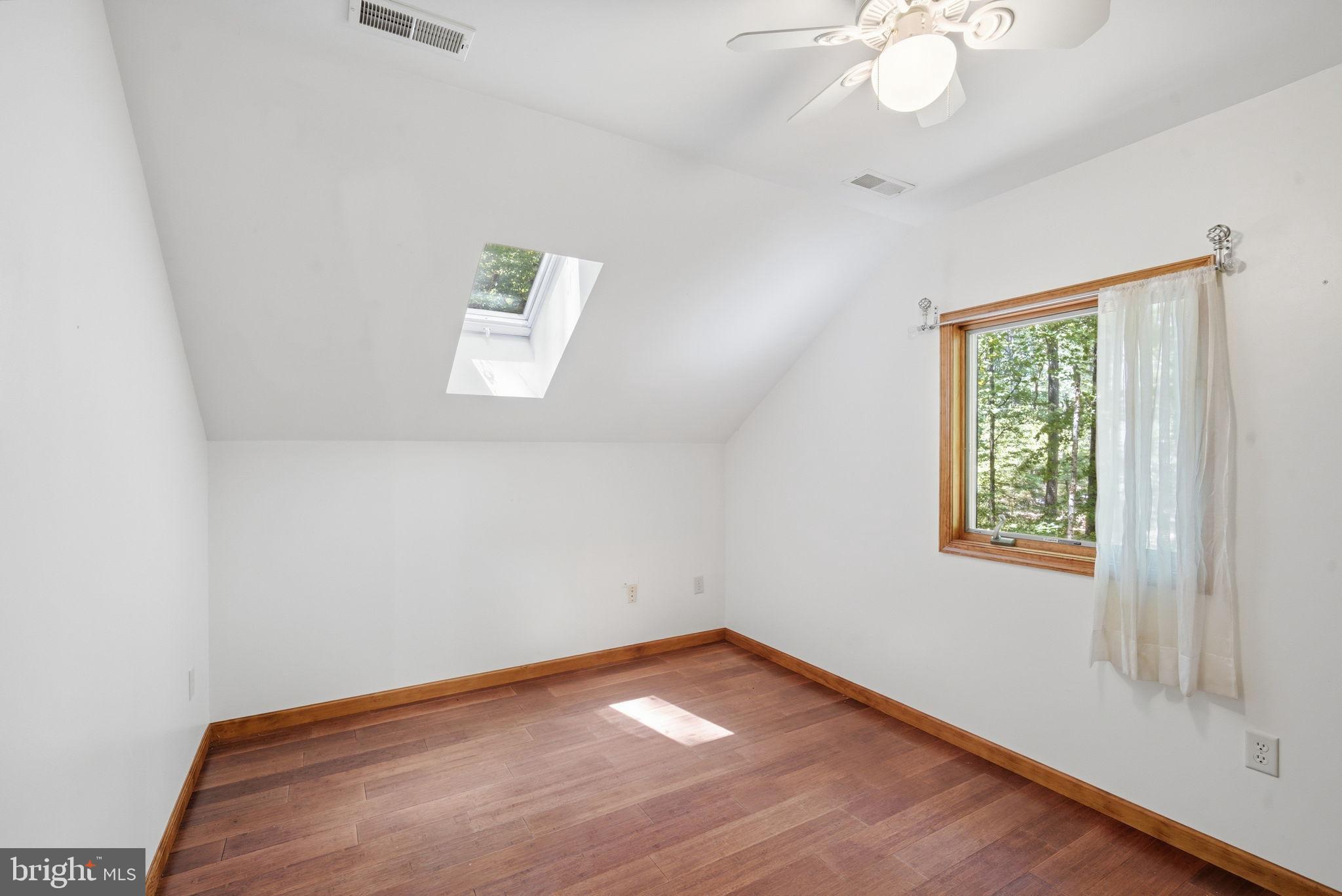 22300 Frazier Road Rock Hall, MD 21661 - Photo 20 of 38 an empty room with a window