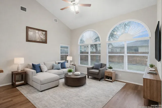 a living room with furniture and a large window