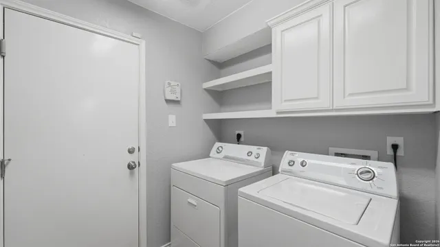 a utility room with dryer and washer