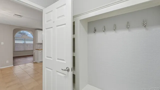 a view of a bathroom from a hallway