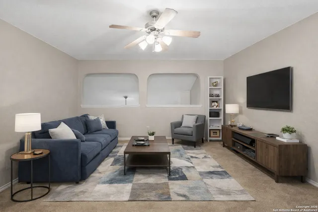 a living room with furniture and a flat screen tv