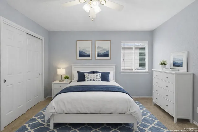 a bedroom with a bed and a dresser