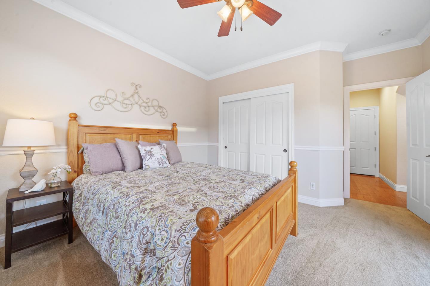 761 Dakota Drive Morgan Hill, CA 95037 - Photo 13 of 32 a bedroom with a bed and a chandelier