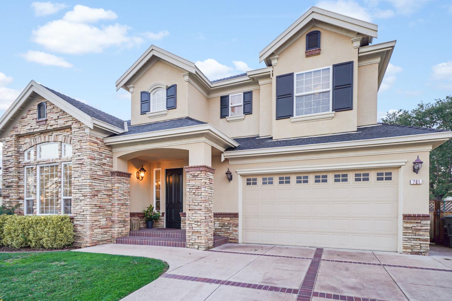 761 Dakota Drive Morgan Hill, CA 95037 - Photo 2 of 32 a view of a house with brick walls and a yard with a large tree