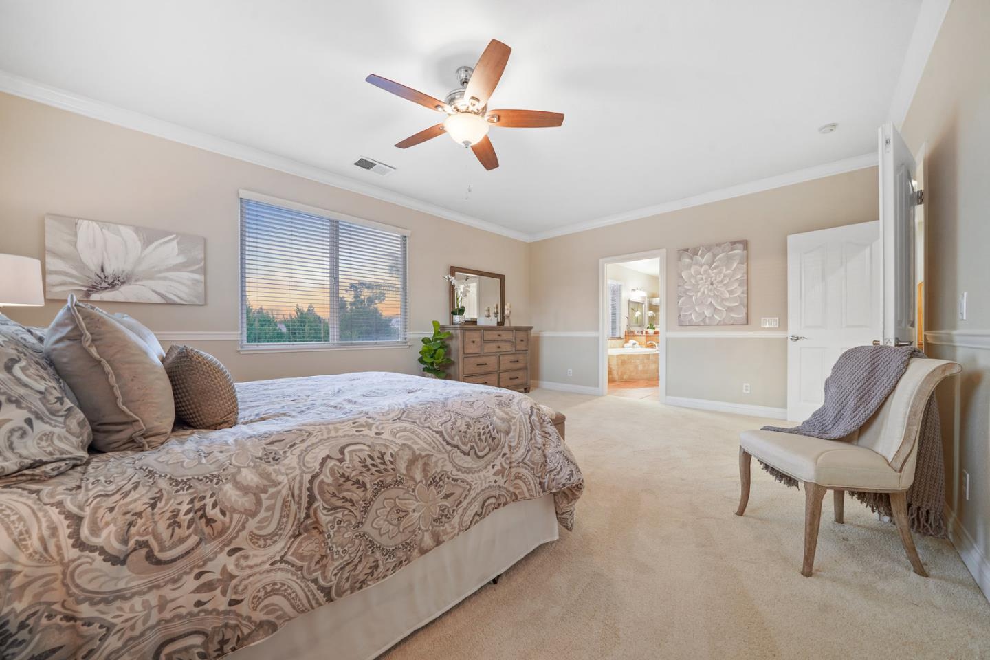 761 Dakota Drive Morgan Hill, CA 95037 - Photo 21 of 32 a bedroom with a large bed and a chandelier