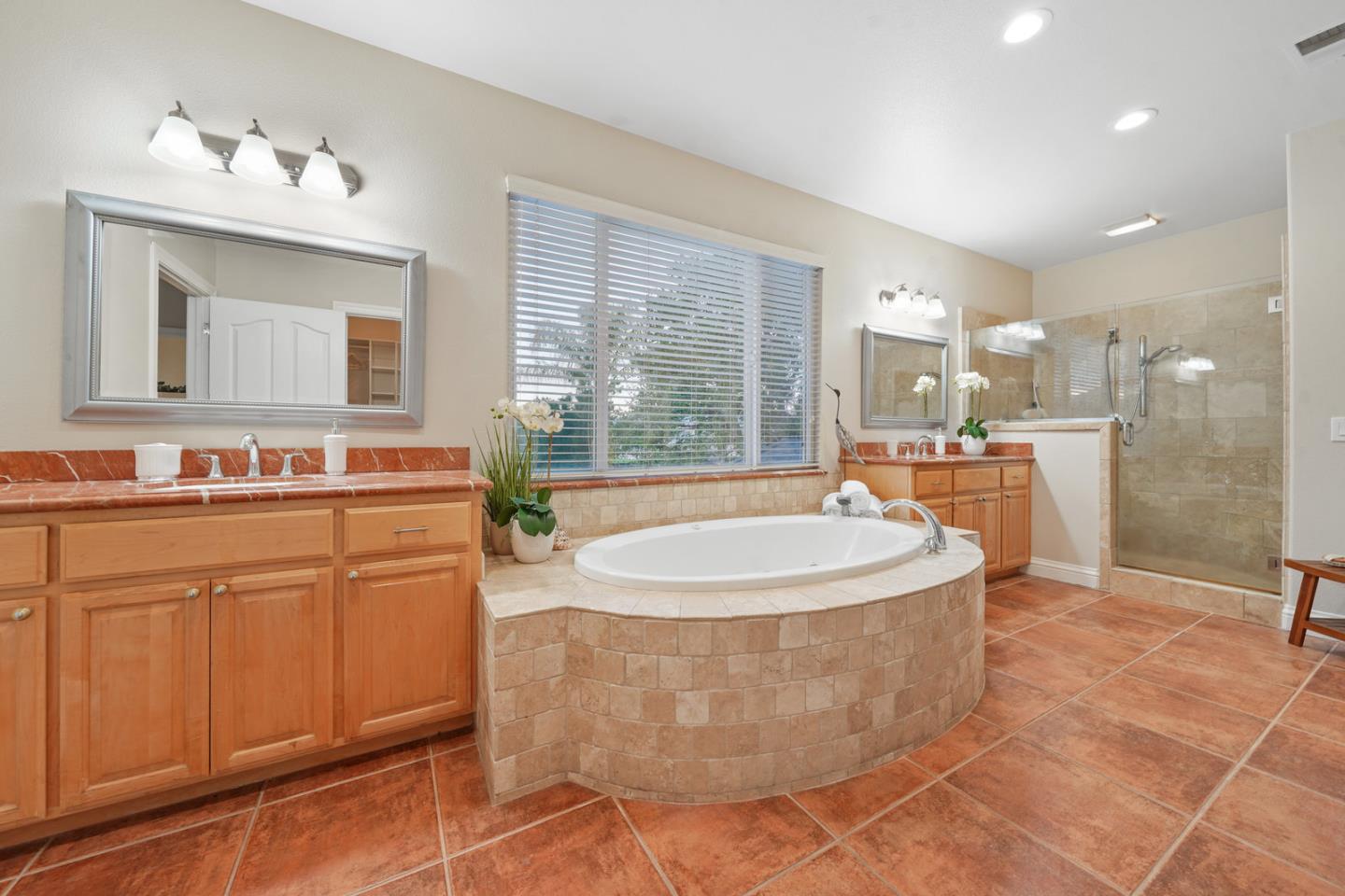 761 Dakota Drive Morgan Hill, CA 95037 - Photo 22 of 32 a spacious bathroom with a tub sink and mirror