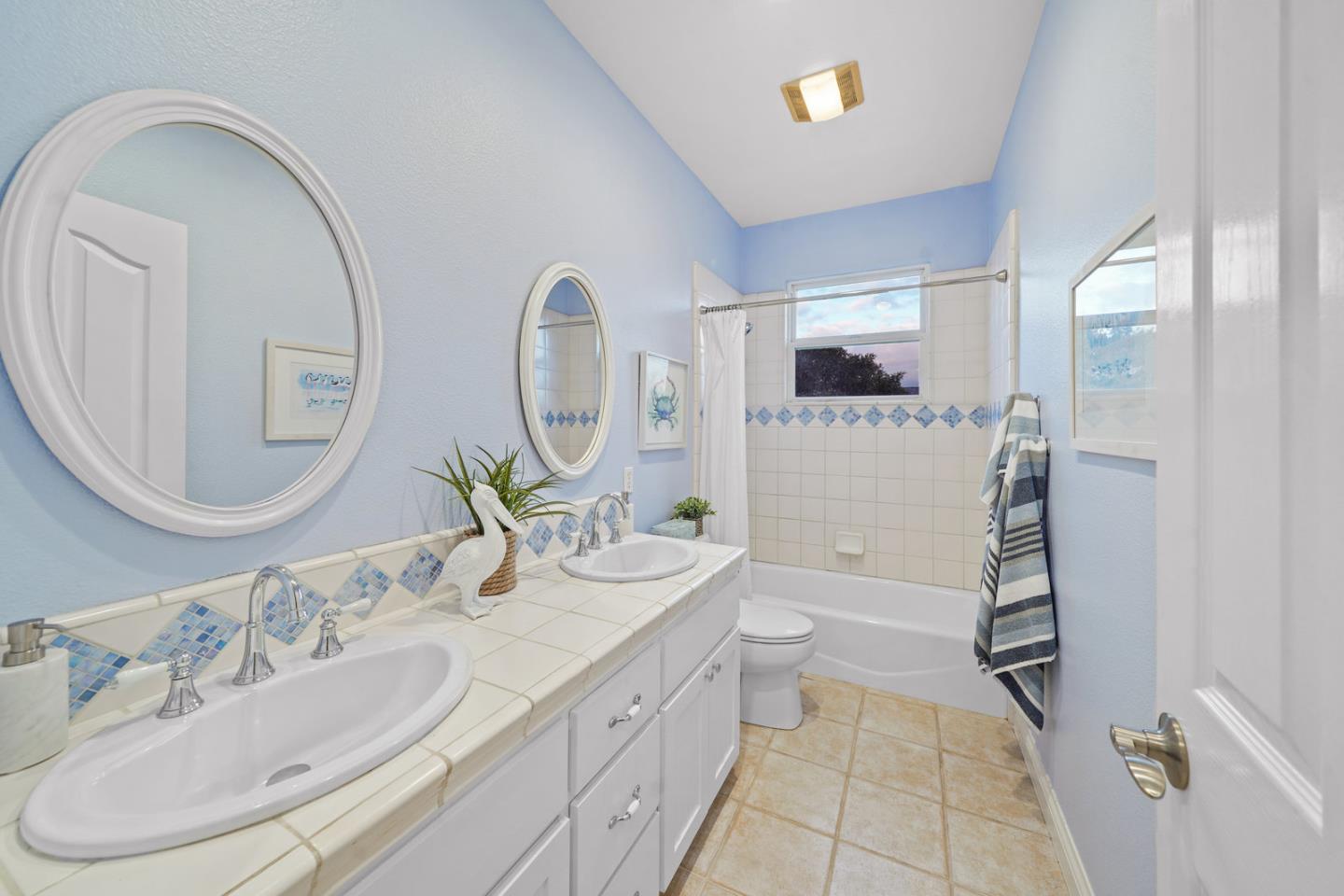 761 Dakota Drive Morgan Hill, CA 95037 - Photo 26 of 32 a bathroom with a double vanity sink and a mirror