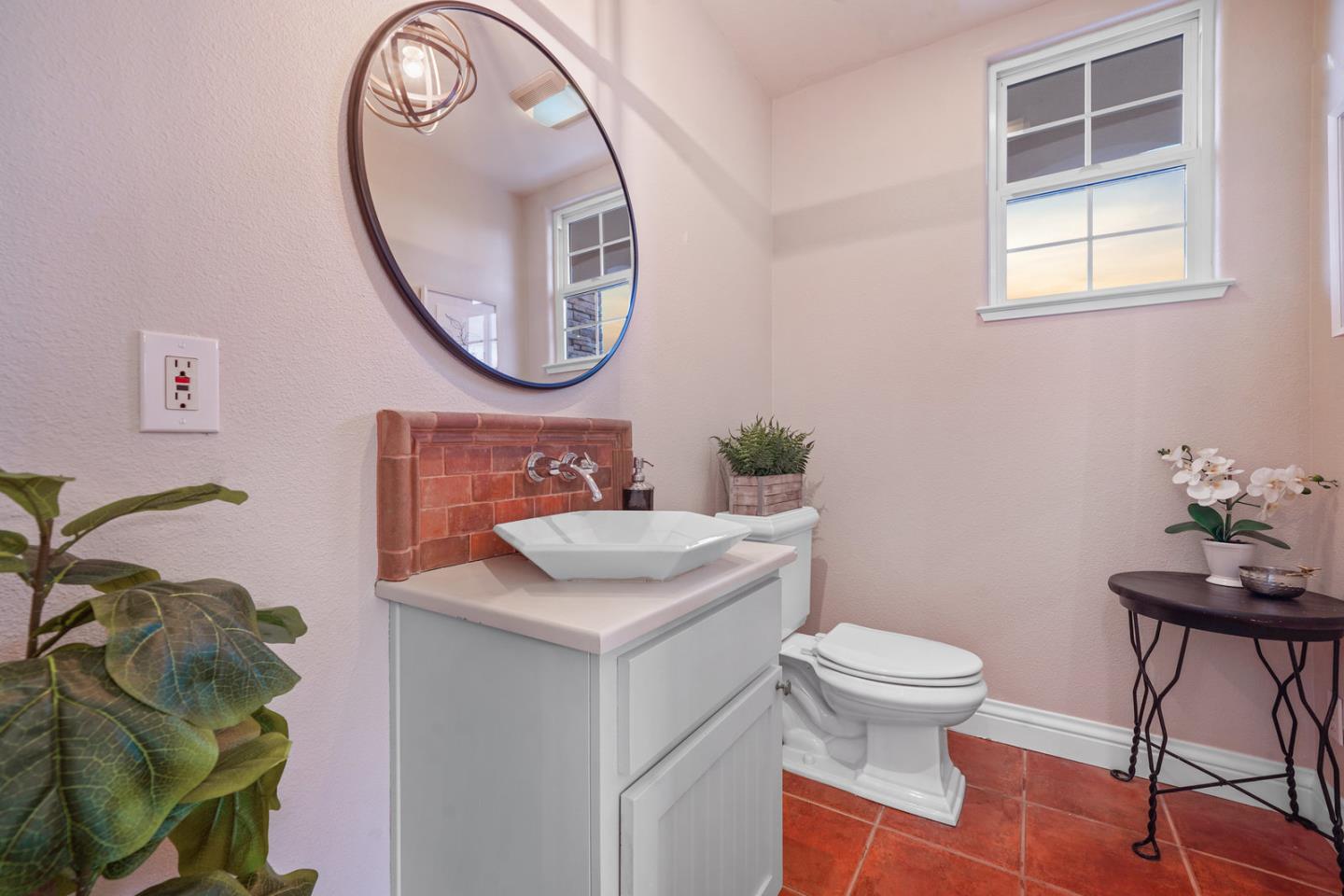 761 Dakota Drive Morgan Hill, CA 95037 - Photo 27 of 32 a bathroom with a sink a mirror and a toilet