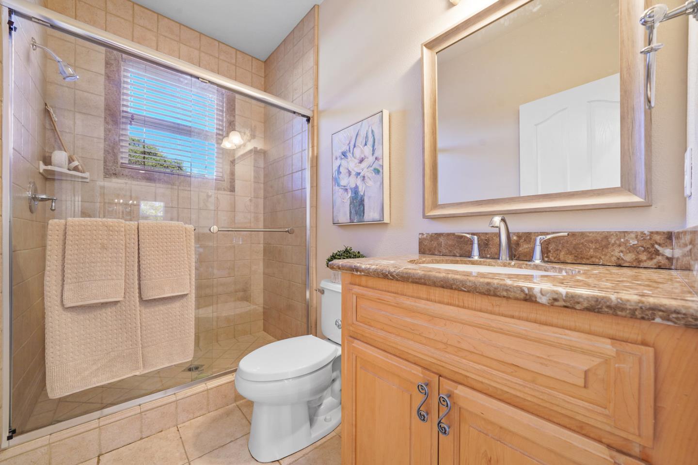 761 Dakota Drive Morgan Hill, CA 95037 - Photo 28 of 32 a bathroom with a granite countertop sink toilet and shower