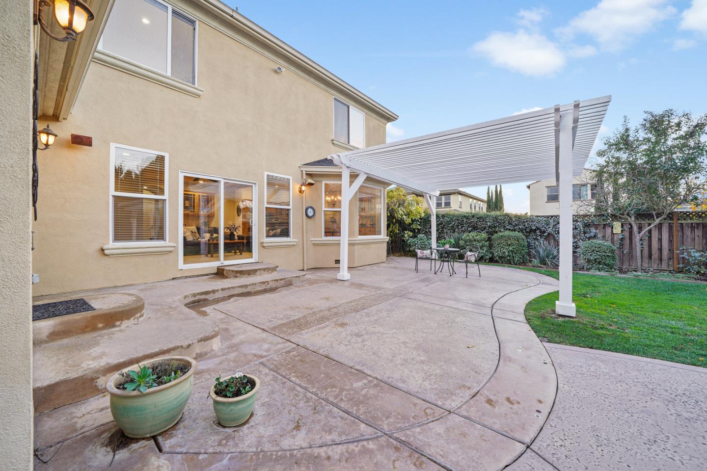 761 Dakota Drive Morgan Hill, CA 95037 - Photo 32 of 32 a view of a backyard with table and chairs and potted plants