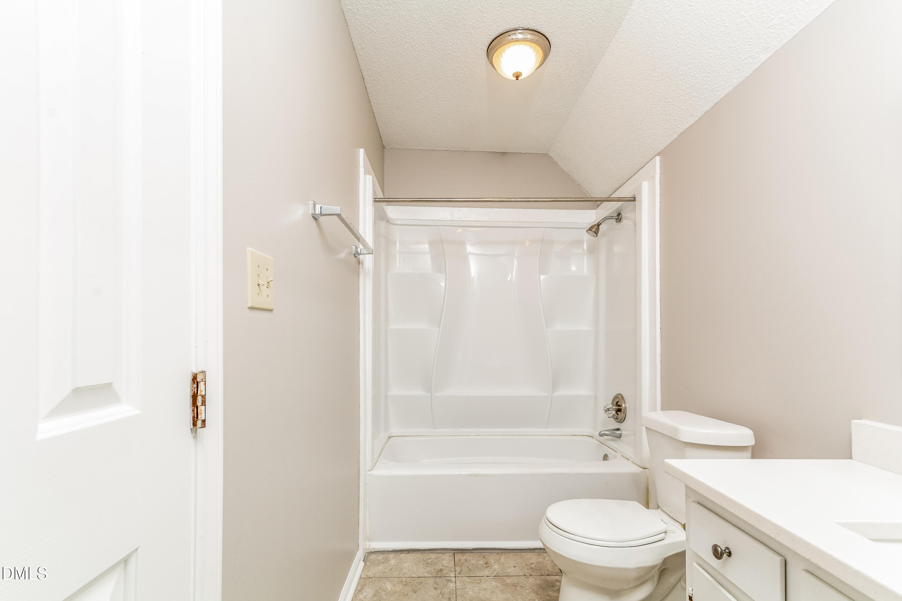 405 Hunters Ridge Drive Fuquay-Varina, NC 27526 - Photo 14 of 17 a bathroom with a bathtub shower sink vanity and a toilet