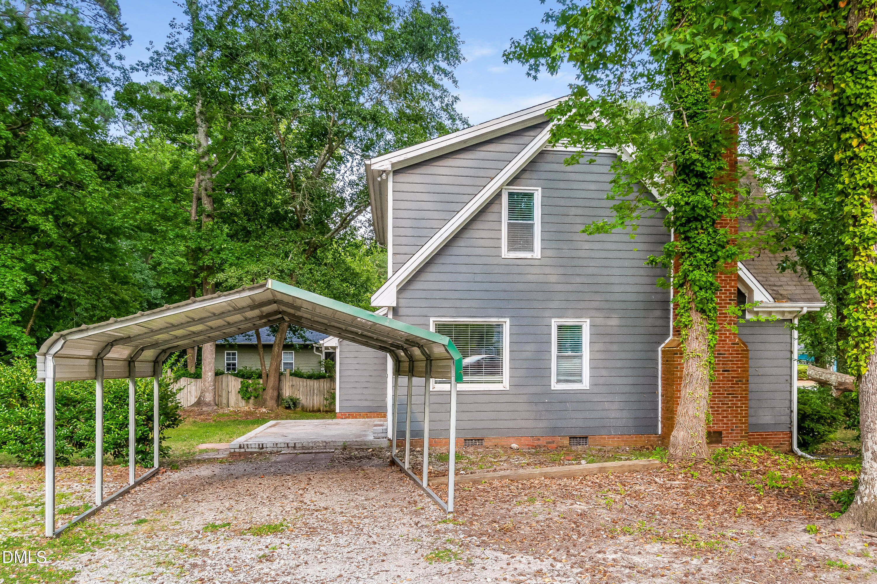 405 Hunters Ridge Drive Fuquay-Varina, NC 27526 - Photo 15 of 17 a front view of a house with a yard