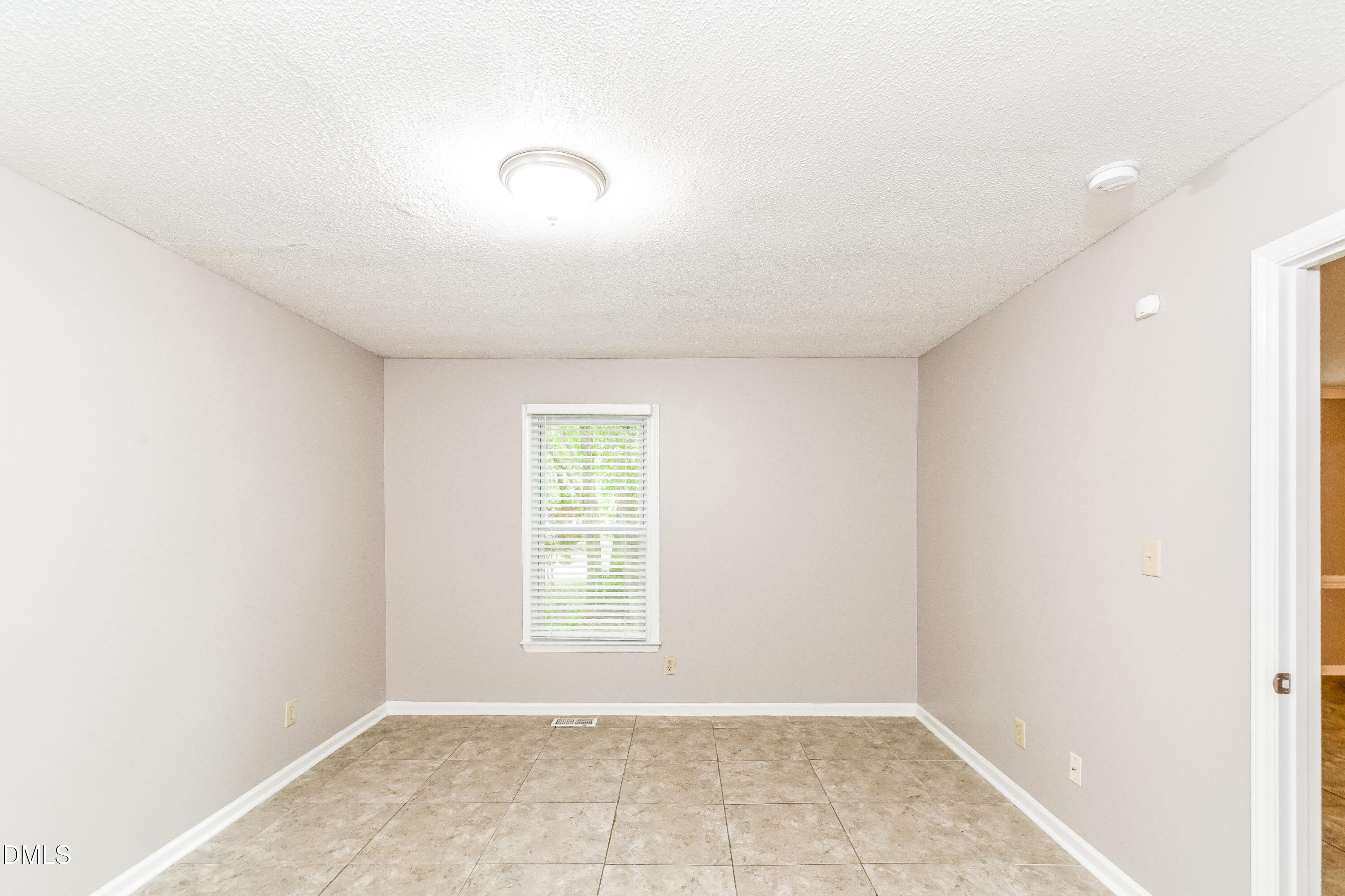 405 Hunters Ridge Drive Fuquay-Varina, NC 27526 - Photo 5 of 17 an empty room with windows