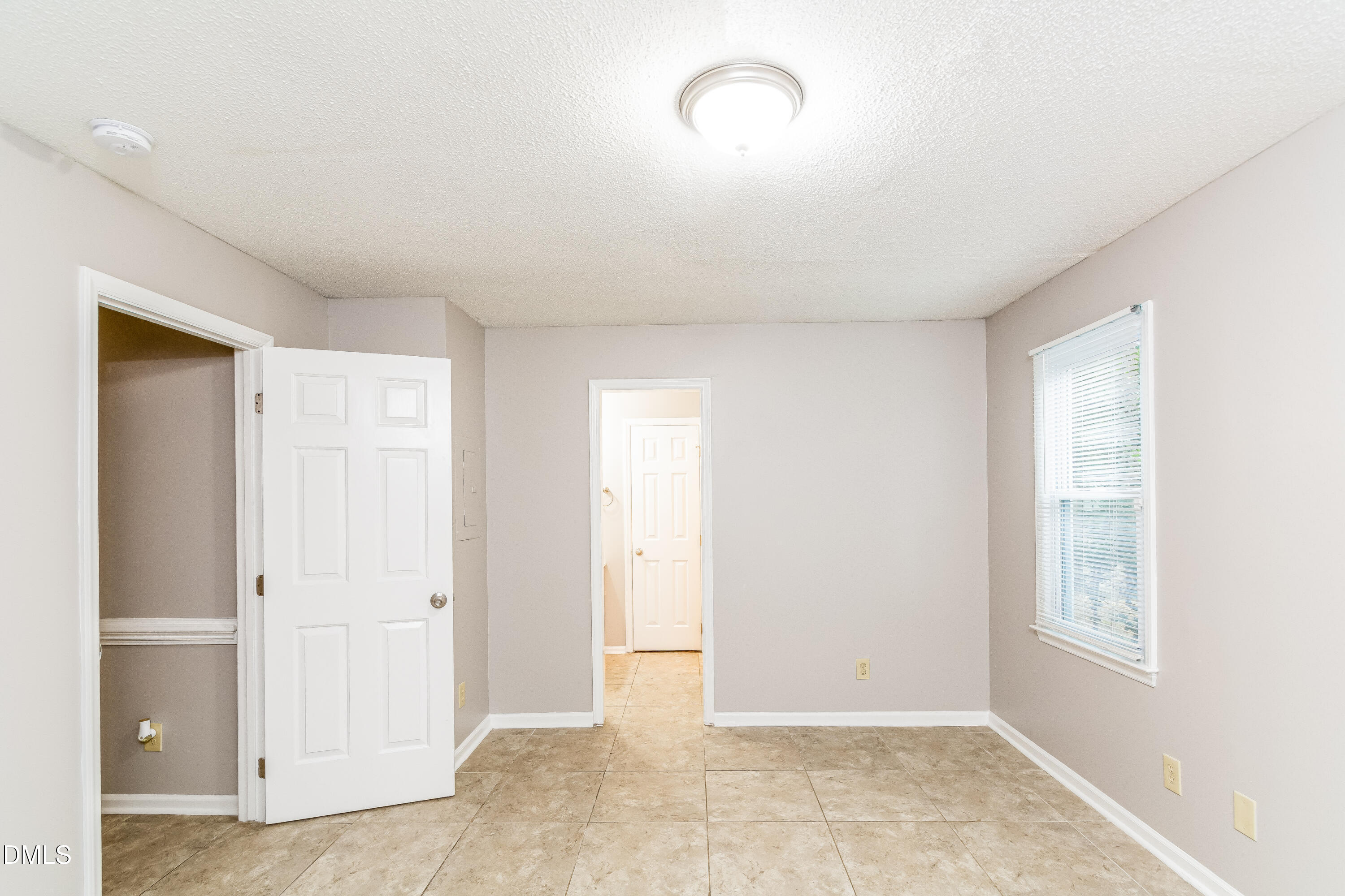 405 Hunters Ridge Drive Fuquay-Varina, NC 27526 - Photo 6 of 17 a view of an empty room with a window