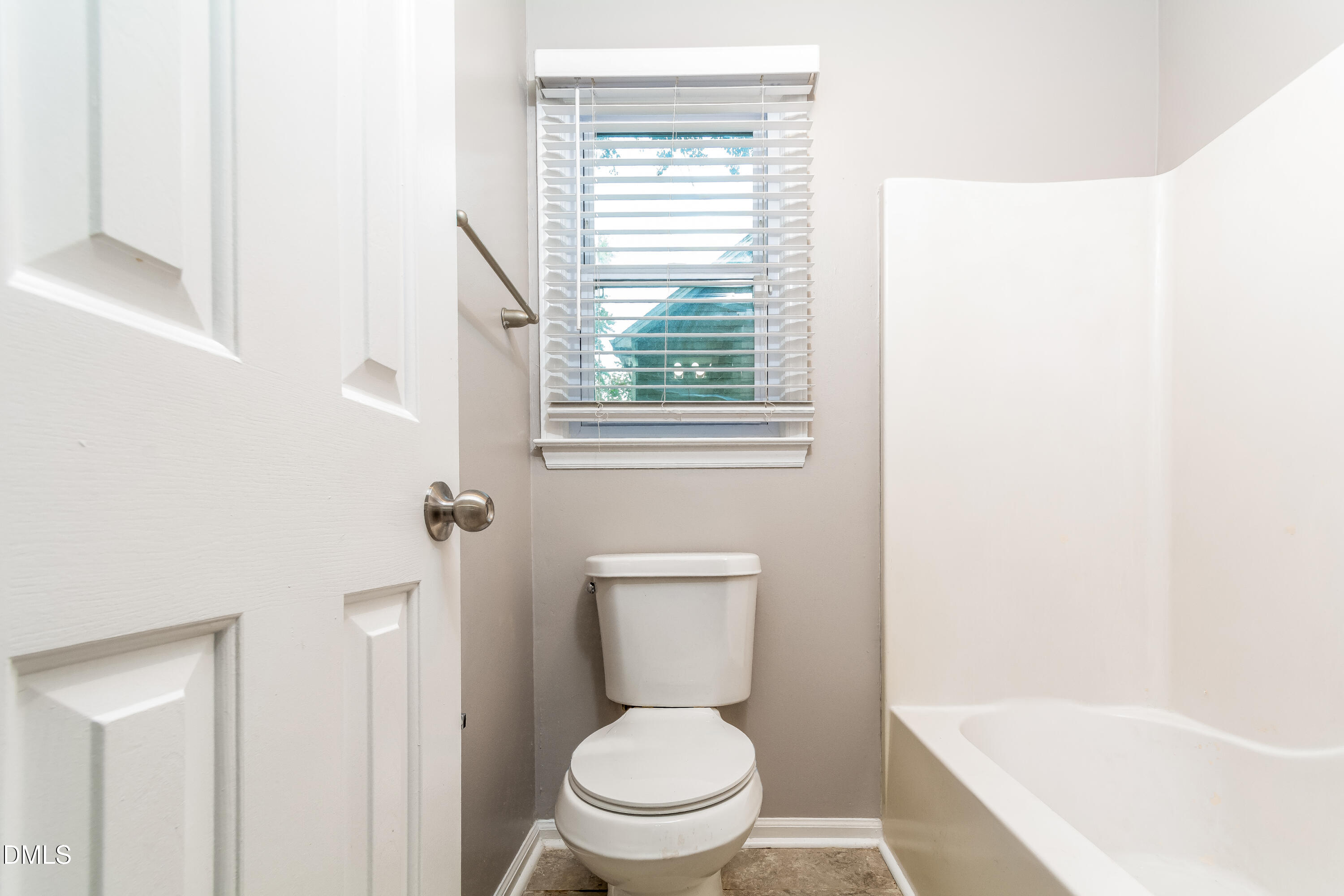 405 Hunters Ridge Drive Fuquay-Varina, NC 27526 - Photo 7 of 17 a white toilet sitting next to a bath tub