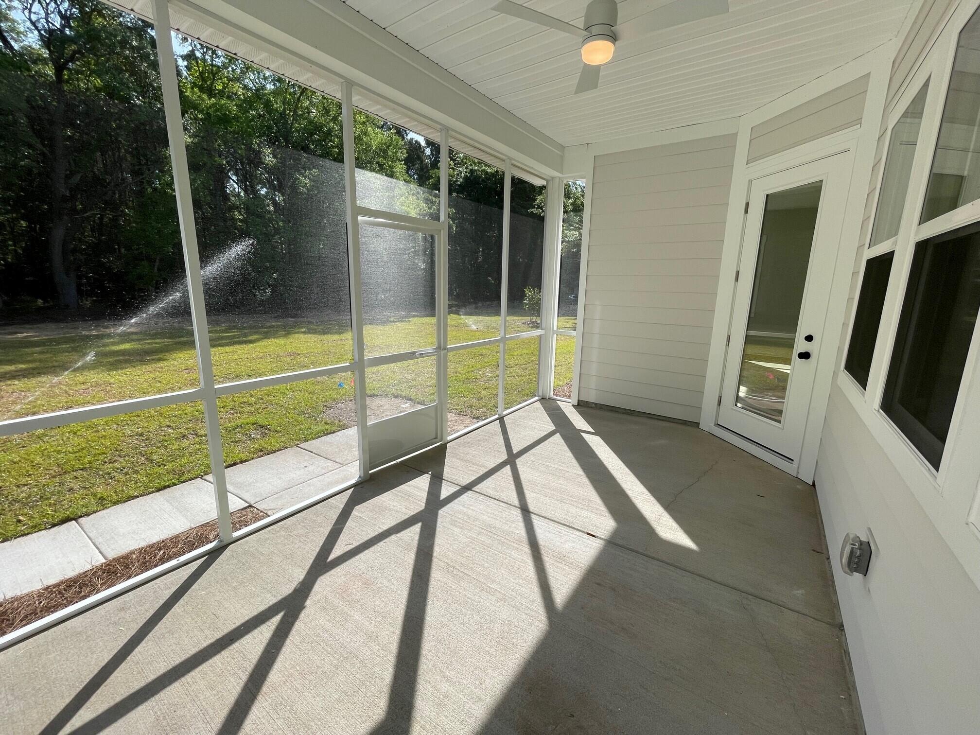 1052 Theodore Road Awendaw, SC 29429 - Photo 11 of 23 Screened In Porch