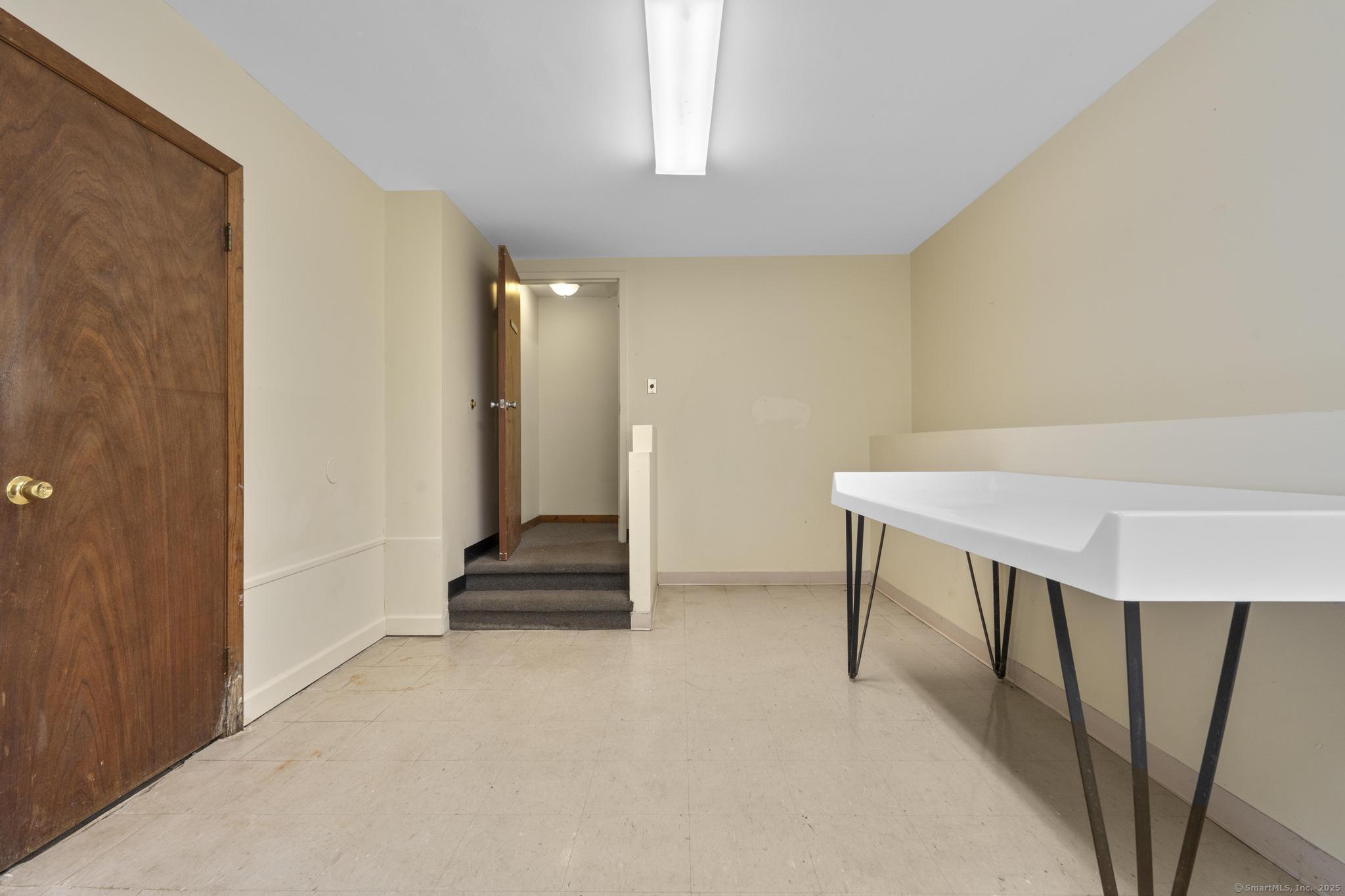 23 Shirley Street, Unit 3 Waterbury, CT 06708 - Photo 15 of 35 a view of an entryway with staircase