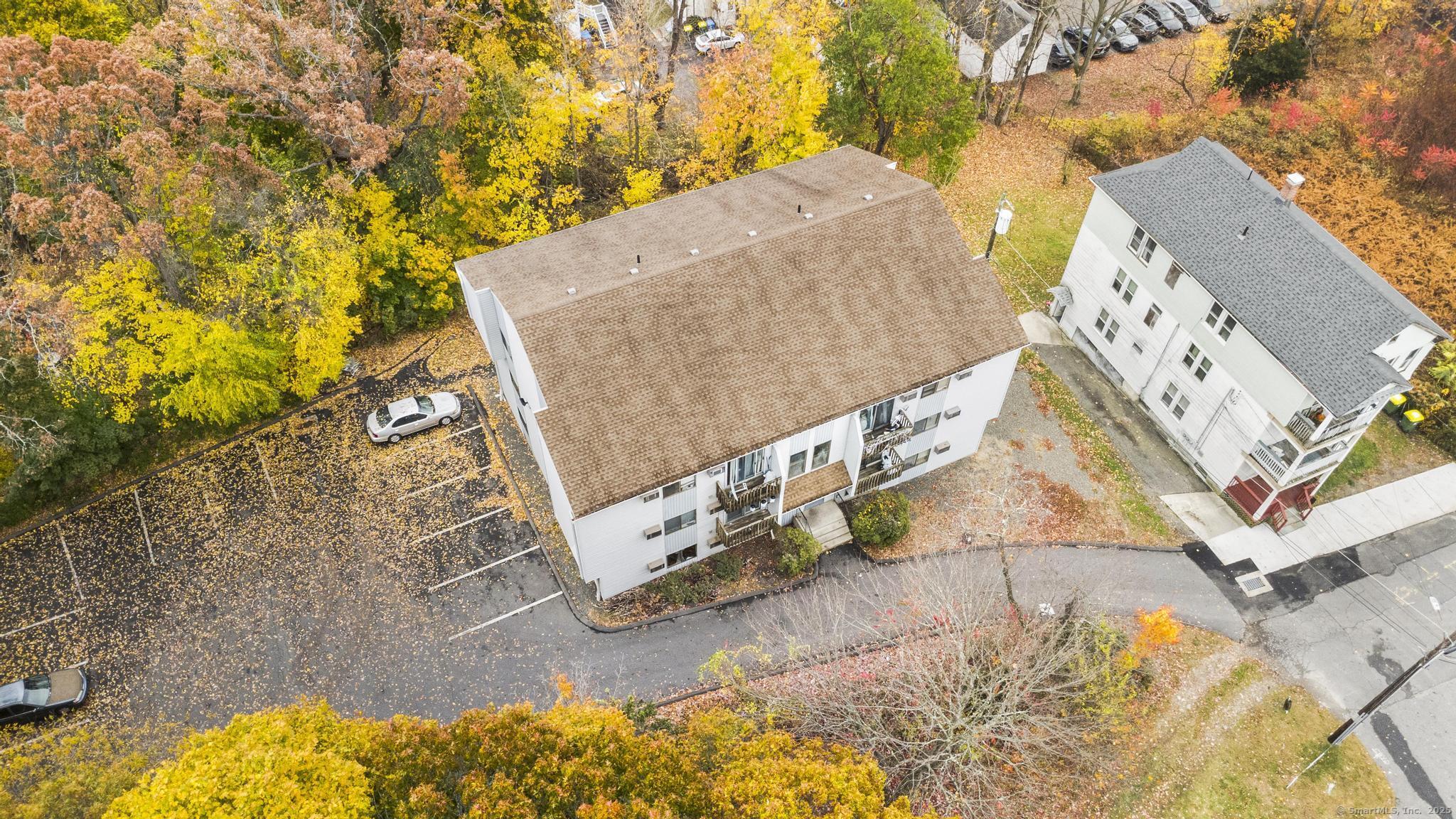 23 Shirley Street, Unit 3 Waterbury, CT 06708 - Photo 22 of 35 an aerial view of a house with a yard and sitting area