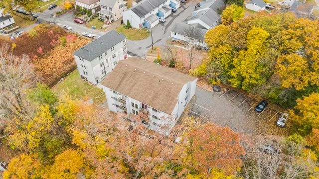 an aerial view of residential houses with street view