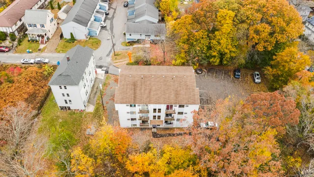 a view of a balcony with wooden floor and fence