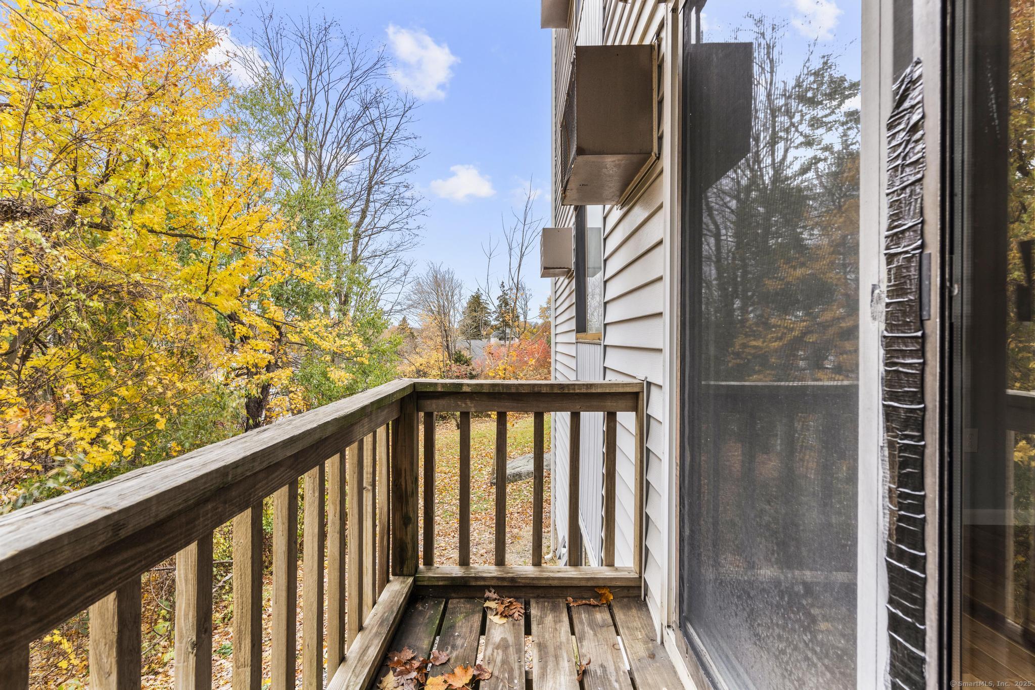 23 Shirley Street, Unit 3 Waterbury, CT 06708 - Photo 28 of 35 a view of a balcony with wooden floor and fence