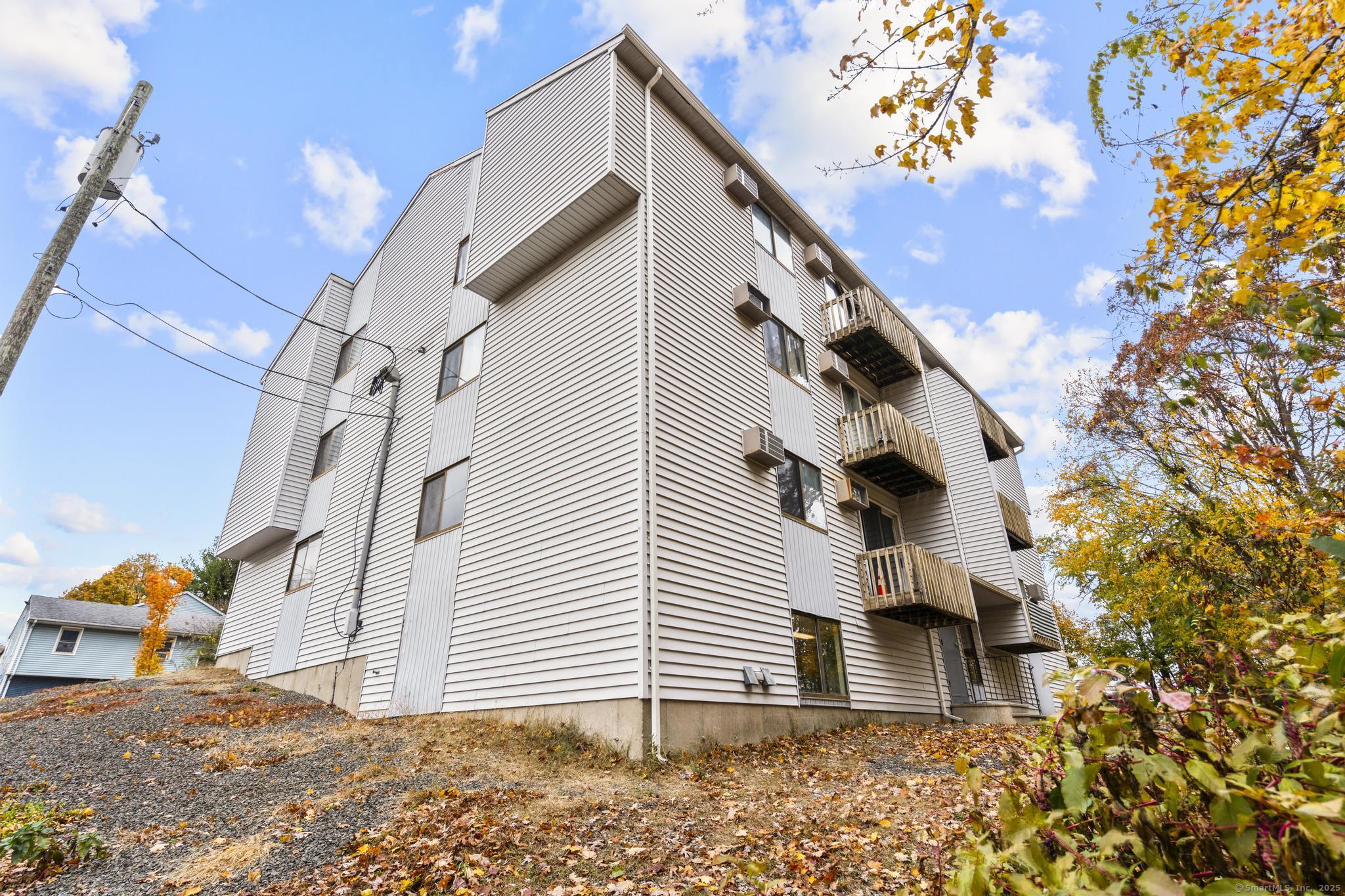 23 Shirley Street, Unit 3 Waterbury, CT 06708 - Photo 31 of 35 a view of a house with a tree