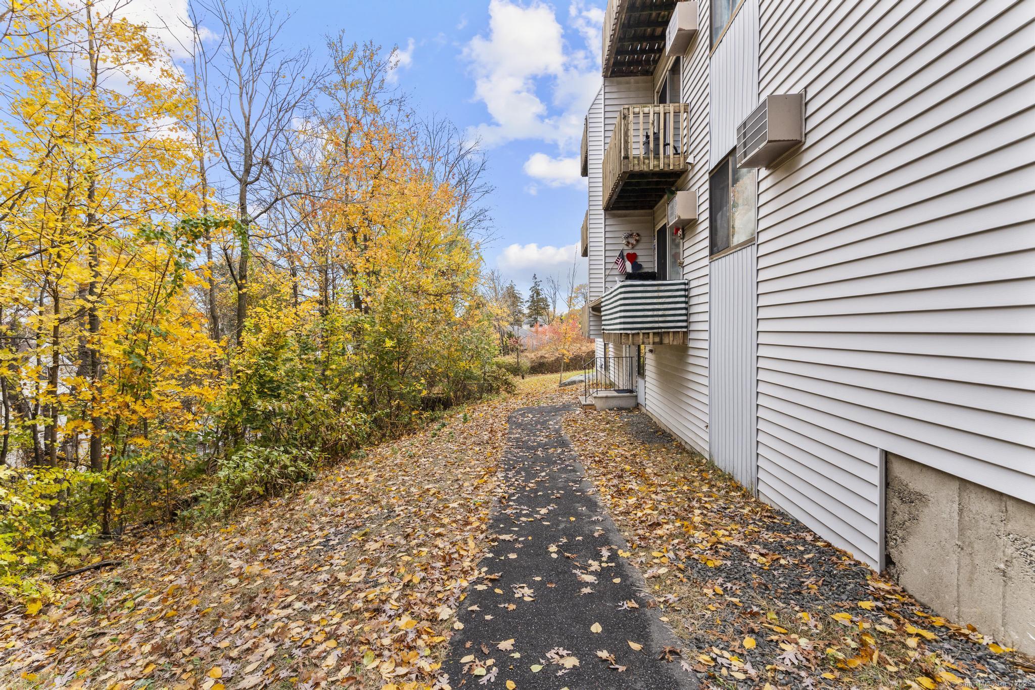 23 Shirley Street, Unit 3 Waterbury, CT 06708 - Photo 32 of 35 a view of a pathway both side of the house