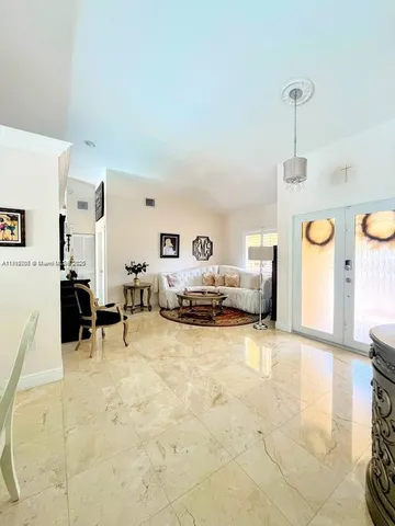 a view of living room with furniture and a window