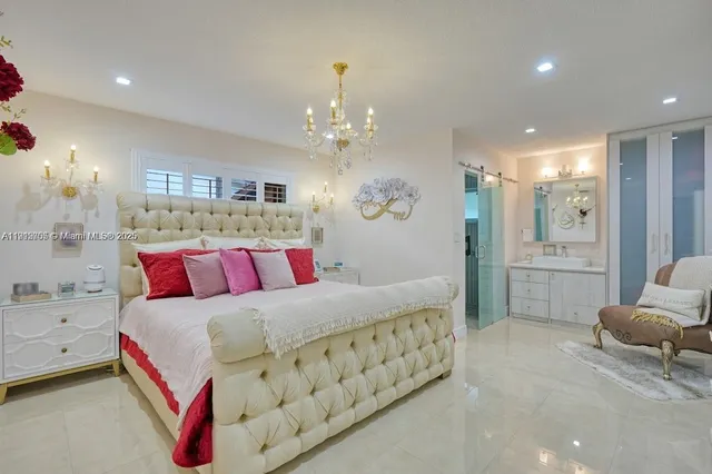 a bedroom with a bed and ceiling fan