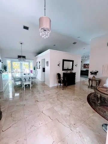 a kitchen with a table and chairs in it