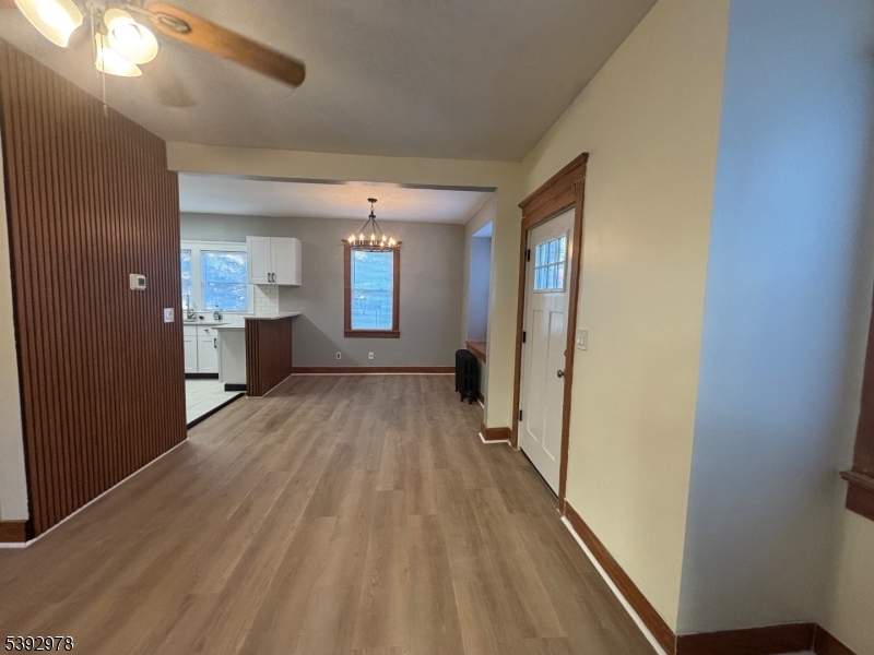 41 Poplar Road Piscataway, NJ 08854 - Photo 13 of 14 a view of a hallway with wooden floor and windows
