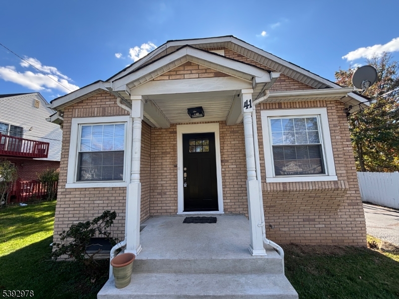 41 Poplar Road Piscataway, NJ 08854 - Photo 2 of 14 a front view of a house with a yard
