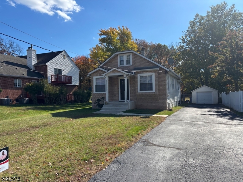 41 Poplar Road Piscataway, NJ 08854 - Photo 4 of 14 a front view of a house with garden