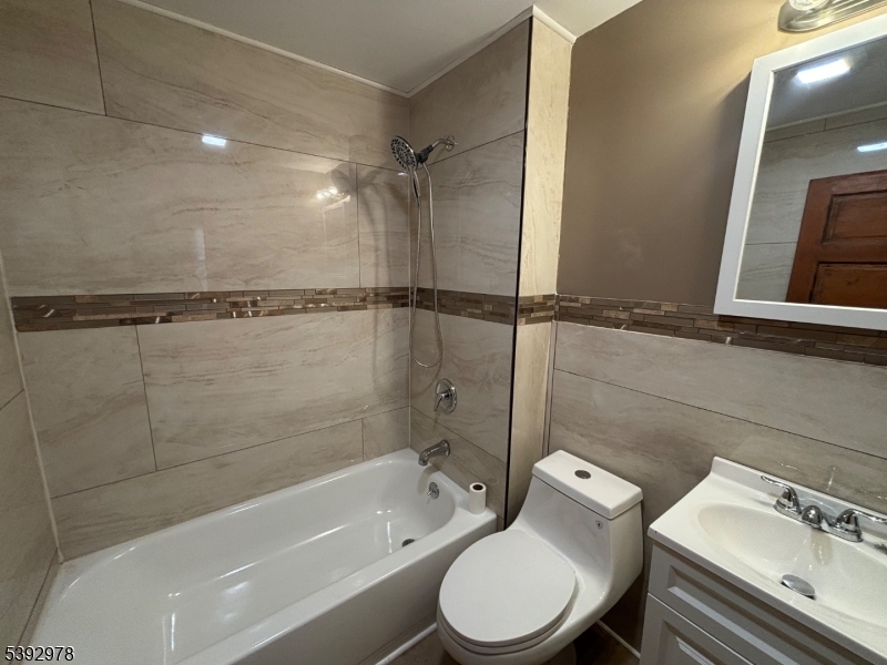 41 Poplar Road Piscataway, NJ 08854 - Photo 7 of 14 a bathroom with a toilet bathtub and shower