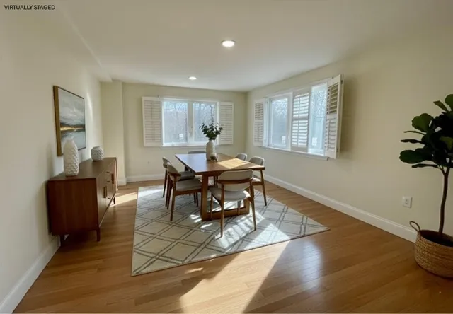 a workspace with furniture window and wooden floor