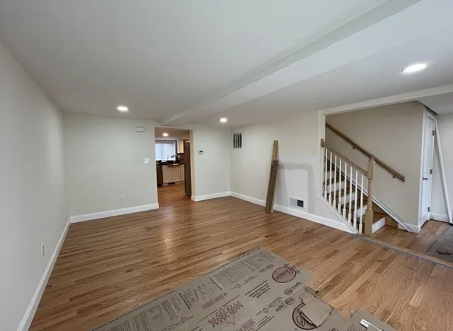 a view of a livingroom with wooden floor