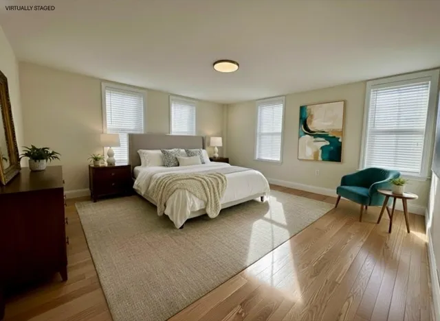 a bedroom with a bed and a couch