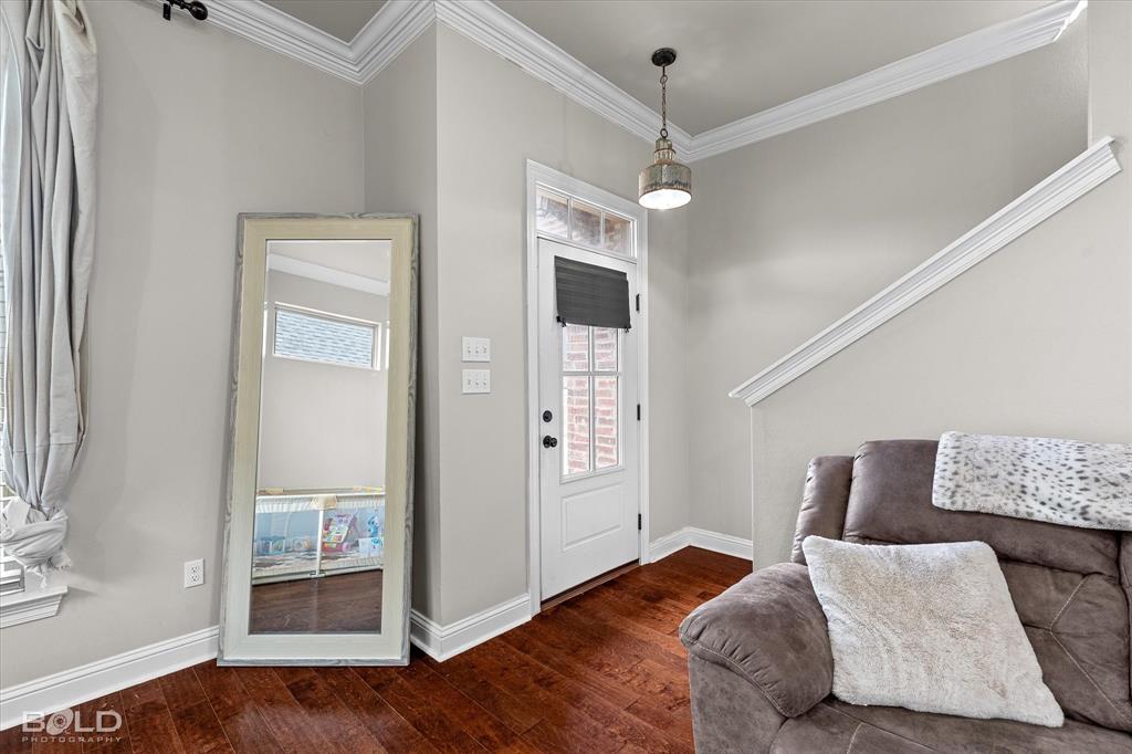 946 Maize Street Bossier City, LA 71111 - Photo 12 of 39 a bedroom with a large bed and wooden floor